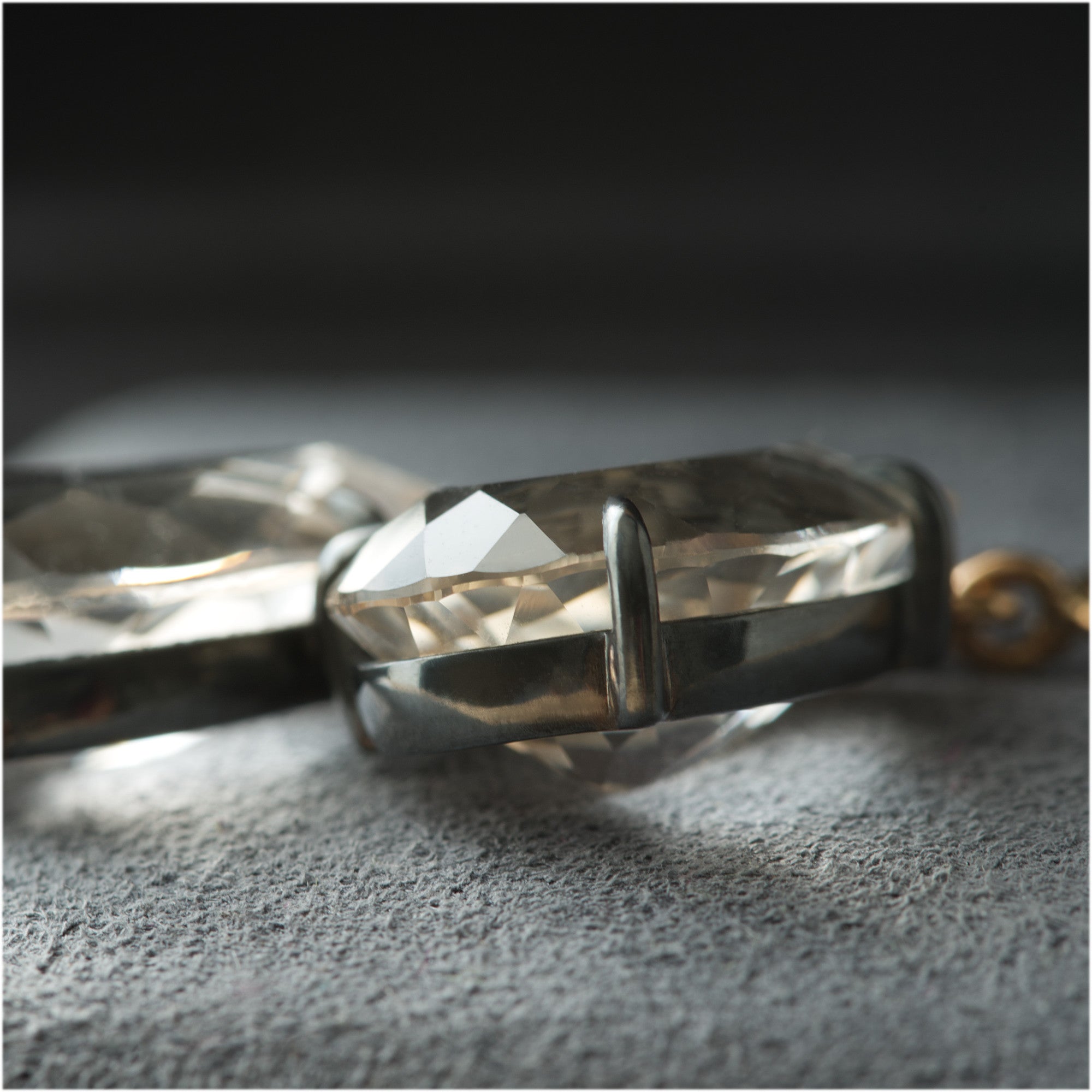 One-of-a-kind 18K gold earrings with blackened silver and white topaz by Ewa Z. Sleziona