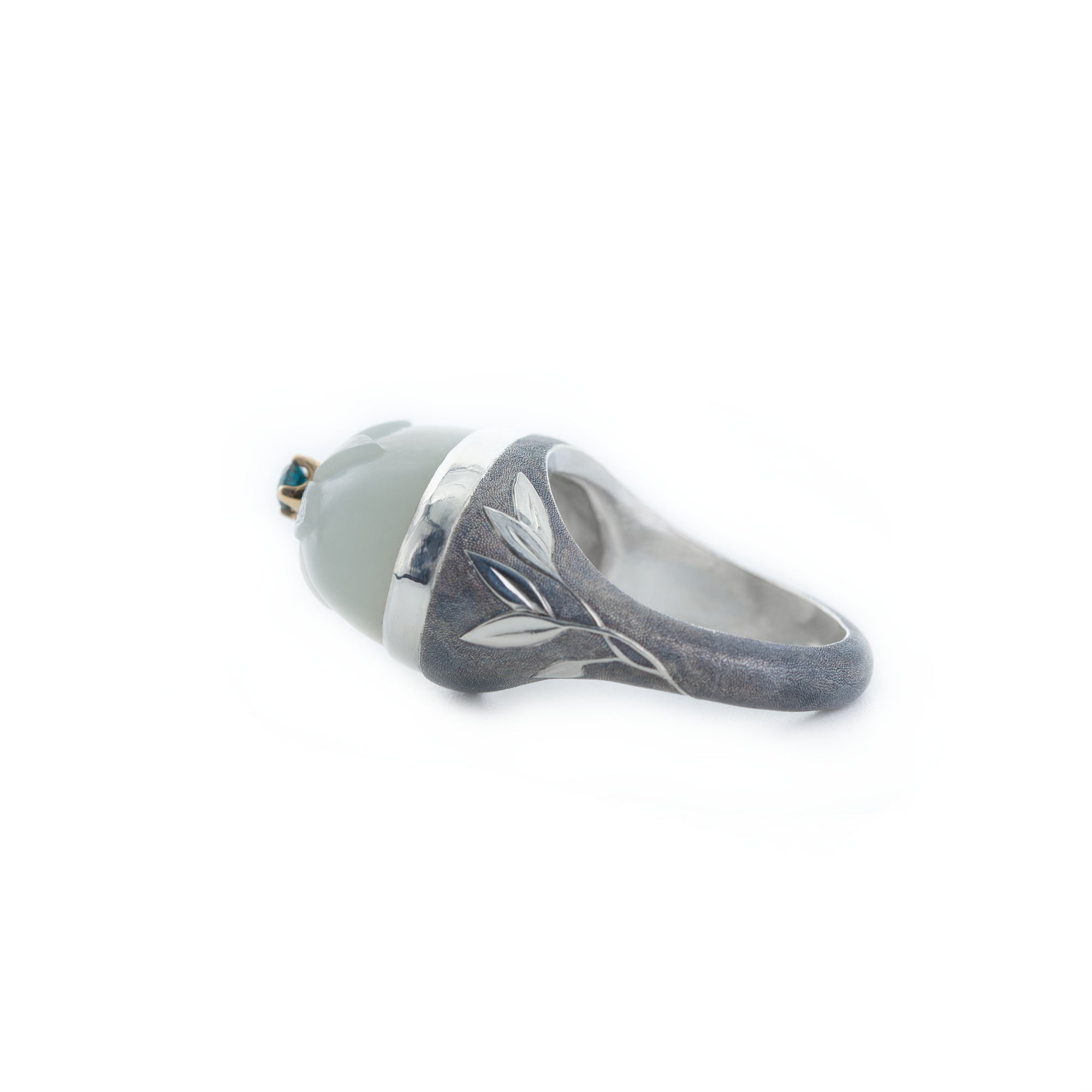 Silver ring with a gray stone on a white background