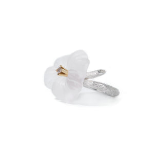 Picture presents a left side of the white pansy flower ring carved in rock crystal and adorned with chocolate diamond presented on white background.